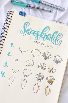 an open spiral notebook with seashells drawn on it and two markers next to it