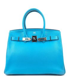 Description: Hermès birkin 30 blue aztec chèvre leather handbag Palladium hardware Protective plastic on hardware Excellent corners and structure Height: 9" Depth: 6" Length: 11.75" Details: Color: Blue AztecMaterial: Chèvre LeatherCondition: PristineBrand: Hermès Shipping: Standard: $9.95Expedited: $19.95 Blue Leather Bag With Lock, Blue Everyday Bag With Lock, Blue Bags With Lock For Formal Occasions, Blue Rectangular Bag With Silver-tone Hardware, Luxury Blue Bags With Silver-tone Hardware, Rectangular Blue Bag With Silver-tone Hardware, Modern Blue Bags With Silver-tone Hardware, Luxury Light Blue Bags With Silver-tone Hardware, Blue Rectangular Bag With Metal Hardware