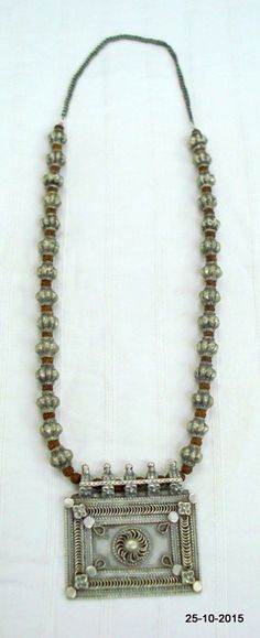 vintage antique tribal old silver necklace from rajasthan india. great handmade design made of solid silver and rudraksha beads. nice piece good for jewelry collection.length - 62 cm(24.4") we can adjust the length.pendant size - 6.3 cm(2.5")weight - 95 gramsmaterail - silver & rudraksha beads. Adjustable Antique Silver Necklace For Festivals, Silver Beaded Temple Necklace For Festivals, Festival Silver Beaded Temple Necklace, Silver Beaded Necklaces For Rituals, Handmade Silver Mala For Festivals, Hand-strung Silver Necklaces For Festivals, Silver Hand-strung Necklaces For Festivals, Silver Beaded Mala For Festivals, Traditional Silver Mala For Festivals