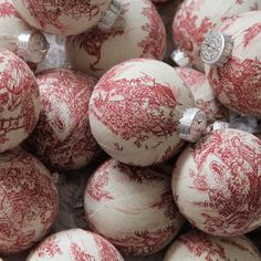 red and white ornaments are piled on top of each other