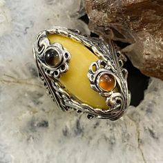 Magically Beautiful Carolyn Pollack Vintage Southwestern Style Sterling Silver Oval Yellow Jasper, Round Smoky Quartz And Round Citrine Cabochons Decorated Ring For Women. The Gorgeous Butter Yellow Stone Is Set In A Leaf And Floral Bezel And 2 Earth Tone Stones Sit Atop Of It In Smooth Bezels With Floral Embellishments. The Shank Consists Of 2 Intertwined Leaves. This Design Has An Oxidized Finish With Beautiful Polished Accents. Size 5 1/2, 9, 9 3/4, 10 Length 1 1/8" Weighs Approx 12.3 Grams ** Stones Are Natural Therefore Matrix And Color Shades May Vary. ** ** If Oxidation Or Tarnish Darkens The Piece Over Time, Use A Polishing Cloth To Restore To Desired Finish. ** Yellow Jasper, Butter Yellow, Yellow Stone, Citrine Ring, Southwestern Style, Ring For Women, Color Shades, Smoky Quartz, Womens Jewelry Rings