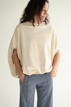 This sweatshirt has a very wide body and a ribbed hem that is gathered to create a unique silhouette. The body is wide, and the shoulders drop moderately, creating a sleeve length to just above the elbows finishing in a ribbed cuff. This is a simple yet stylish piece with an unexpected silhouette and comfortable fit. Jersey material with a good thickness and taut ‘Kanoko’ style structure (Moss stitch). It looks like a knit, but its firmness, lightness and fullness make it a very comfortable and Relaxed Fit Sweatshirt With Ribbed Cuffs And Drop Shoulder, Relaxed Fit Drop Shoulder Sweatshirt With Ribbed Cuffs, Oversized Crew Neck Activewear With Ribbed Cuffs, Oversized Cotton Sweatshirt With Ribbed Cuffs, Functional Sweat-resistant Crew Neck Top, Peter Pan Collar Blouse, Petal Sleeve, Moss Stitch, Collar Blouse