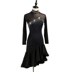 a black dress with silver sequins on the neck and long sleeves is displayed