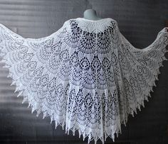 Cream shawl lace Bridal shawl wrap made with soft and cozy merino wool yarn in ivory(cream) color. *Handmade! *Size: lenght is about 35,4'' (90cm) width is about 78,7''(200cm) *Yarn: soft merino wool *Colours: ivory,black and other custom colours available Lightweight hand knitted shawl wrap is versatile item for any season and indispensable accessory for everyday life and for special occasions,is a perfect gift to friends or yourself This shawl has vintage vibe and looks great as a shawl cape with wedding gown in Victorian ,Boho,Gothic styles.You can made your own romantic style with this marvelous shawl! *Washing Instruction: I recommend gently hand wash in lukewarm or cold water with the addition of small amount of wool detergent.Lay flat to dry and block with pins if needed. One Size Crochet Lace Shawl, One Size Lace Shawl, White Crochet Lace Shawl, White Crochet One-size Shawl, Handmade Cream Shawl One Size, Handmade One Size Shawl For Weddings, Handmade One-size Shawl For Wedding, Handmade One-size Wedding Shawl, White Crochet Lace Shawl One Size