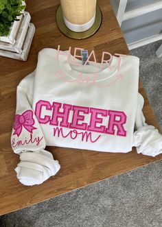 ** Please read before buying **  ✨ Embroidered Glitter Sweatshirt ✨ Show your pride and support for your athlete with our stunning cheer sweatshirt! Whether you're a Mom, Dad, Sister, Girlfriend, or any proud supporter, this cozy and stylish sweatshirt is perfect for cheering from the stands or staying warm on those chilly game days. Featuring custom embroidery with a glitter design that adds just the right amount of sparkle, this sweatshirt will keep you comfortable while making sure everyone k Cheer Mom Shirt, Cheerleading Shirts, Cheer Mom Shirts, Cheer Coaches, Football Mom Shirts, Bow Shirt, Cheer Shirts, Cute Shirt Designs, Bow Shirts