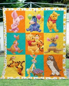 the winnie the pooh quilt is on display