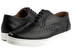 Alexander Noel Kickabout Wing Tip Sneaker Low Top - Men's Shoes : Black/White : The Alexander Noel Kickabout Wing Tip Sneaker Low Top combines executive with casual, corporate with comfort, and stylish with a suit. The wingtip oxford, hand-crafted from its leather top to the rubber sole. Designed in supple, smooth full black calf leather. The two-in-one style offers comfort and style for a full day of work all the way through an evening event. Rich calfskin leather texture with brown durable sho Classic Wingtip Oxfords With Contrast Sole, Business Wingtip Oxfords With Contrast Sole, Casual Wingtip Oxfords With Leather Sole, Casual Wingtip Oxford Shoes, Casual Wingtip Oxfords For Business, Casual Sneakers With Brogue Detailing For Business Casual, Classic Oxfords With Contrast Sole For Business Casual, Wingtip Oxfords With Contrast Sole For Work, Casual Wingtip Oxfords In Oxford Material