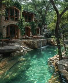 an outdoor swimming pool surrounded by trees and water features stone steps leading up to the house