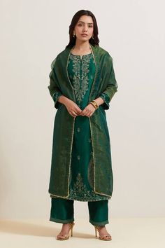 Green natural weaves chanderi silk kurta with contrast paisley and floral embroidery. Comes with pant and shimmer organza dupatta.
Components: 3
Pattern: Embroidered
Type Of Work: Floral and Paisley
Neckline: Notched
Sleeve Type: Three Quarter
Fabric: Chanderi Silk, Shimmer Organza
Color: Green
Other Details: 
Embroidered hem pant
Fringed border dupatta
Occasion: Puja - Aza Fashions Festive Banarasi Silk Kurta With Embroidered Border, Banarasi Silk Kurta With Embroidered Border, Eid Banarasi Silk Kurta With Embroidered Border, Unstitched Banarasi Silk Churidar With Embroidered Border, Elegant Art Silk Churidar With Embroidered Border, Bollywood Silk Churidar With Embroidered Border, Festive Tussar Silk Churidar With Embroidered Border, Bollywood Style Tussar Silk Palazzo Set With Embroidered Border, Diwali Tussar Silk Palazzo Set With Embroidered Border