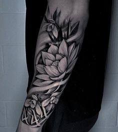 a person with a flower tattoo on their arm