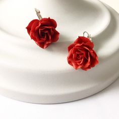 These red rose earrings are fully handmade. Each element is made entirely by hands from material called cold porcelain and toned with soft pastel. These flowers look much like fresh flowers but they will never fade. I use only non-allergic nickel free bases for my items.Diameter of flower – 1 inches (2,5 cm)Sterling silver metalThese earrings with pink roses are perfect for woodland, greenery or rustic weddings and other celebrations. But also they will be good even as casual accessory. Flowers Red Polymer Clay Flower Earrings For Gift, Red Flower-shaped Earrings With Handmade Flowers, Handmade Flower-shaped Red Earrings, Red Flower-shaped Earrings With Rose Design, Elegant Red Polymer Clay Earrings, Red Rose Earrings, Red Flower Earrings, Botanical Earrings, Blue Acrylic Nails