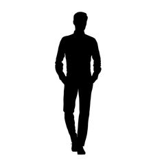 the silhouette of a man standing with his hands in his pockets and wearing a suit