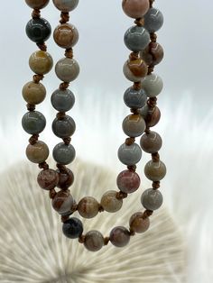 Description: Natural gemstone AMERICAN PICTURE JASPER hand knotted Material: Natural AMERICAN PICTURE JASPER Beads: 6 mm round Polished finish Thread: Brown Length: 36" Finish products are for ideas only. Components can be purchased in my shop. www.instagram.com/blingbya/ @blingbya Adjustable Hand Knotted Brown Beaded Necklace, Adjustable Brown Hand Knotted Beaded Necklace, Adjustable Brown Hand-knotted Beaded Necklace, Adjustable Brown Necklace With 8mm Beads, Adjustable Brown Hand Knotted Necklaces, Brown Adjustable Hand Knotted Necklace, Brown Round Beaded Necklaces For Spiritual Purposes, Brown Beaded Necklaces With 8mm Round Beads, Spiritual Brown Round Beaded Necklaces