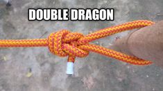 a person holding a rope with the words double dragon on it