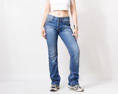 "Guess y2k jeans in blue - button fly - 5 pockets - straight leg - materials: 98% cotton, 2% elastane SIZE label: US 30, EU 38, CN 170/76A best fits women: M/L MEASUREMENTS belt tape: 31.5 inches (80 cm) hips: 38.5 inches (98 cm) rise: 10.5 inches (27 cm) length: 43.5 inches (110 cm) inseam: 33.5 inches (85 cm) The model is 5'9\" (174 cm), measures 35-27-38 (90-69-96 cm) CONDITION: The jeans in great pre-owned condition. Washed. Ready to wear." Y2k Straight Leg Jeans With Five Pockets, Miss Sixty Jeans, Velvet Sweatshirt, Jeans Y2k, Y2k Jeans, Womens Jeans, Guess Jeans, Y2k Vintage, Juicy Couture