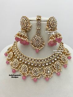 High quality elegant Kundan necklace set comes with beautiful jhumki earrings and tikka set/Kundan Polki Necklace/Reception/Wedding/bridal jewelry/ Indian jewelry /Kundan Jewelry/pink bubblegum All items are shipped from Brampton, Ontario, Canada. If you need your item by a certain day, please reach out to us for express delivery option before placing the order so that we can update the shipping for you. Standard shipping/delivery timeline Below are the delivery timeline estimates. We dispatch all orders by the next business day. ---> USA delivery timeline * 3-6 business days to major urban centers in USA. It may take 1-2 days extra to remote locations ---> Canada delivery timeline  * 2-3 business days - GTA  & Montreal  * 2-4  business days - Rest of Ontario/Quebec * 3-6 business days-  R Pink Indian Jewelry, Kundan Sets Indian Jewelry, Bollywood Style Pink Jewelry Sets For Reception, Pink Kundan Bridal Necklace For Reception, Pink Kundan Jewelry Sets For Celebration, Pink Bollywood Jewelry Sets For Wedding, Heavy Pink Bollywood Jewelry Sets, Dubai Gold Jewelry, Pink Jewelry Set