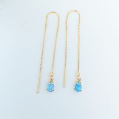 Our Opal Threader Earrings are crafted for the minimalist bride with a choice of dainty blue/pink/white opal stones and a long chain drop design. These thread-through earrings add a touch of something blue to your wedding ensemble, making them ideal for brides seeking delicate and dangly opal jewelry.  Threader earrings are lightweight and pretty chain style earrings. You put them on by threading the chain through your ear lobes, creating and subtle floating effect.  They move and sway with the Linear Long Drop Earrings With Adjustable Chain For Weddings, Minimalist Teardrop Threader Earrings For Wedding, Teardrop Wedding Earrings With Adjustable Chain, Dainty Long Drop Threader Earrings For Wedding, Minimalist Threader Earrings With Adjustable Chain For Wedding, Dainty Blue Earrings For Wedding, Minimalist Wedding Threader Earrings With Adjustable Chain, Adjustable Long Drop Wedding Earrings, Single Long Drop Threader Earring For Wedding