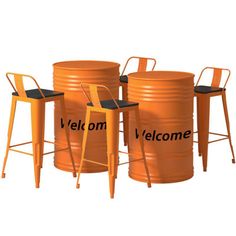 three orange metal barrels with chairs around them and the words welcome written on one side