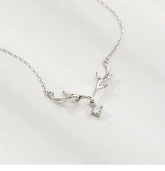 This deer antler necklace is the perfect accessory for anyone looking to add a touch of edgy, natural flair to their outfit. The unique design of the necklace features a genuine deer antler pendant, which is sure to draw attention and spark conversation. The antler has been expertly polished and crafted into a sleek, stylish shape that is both elegant and modern. The necklace is versatile and can be worn with a variety of outfits, from casual to formal. It is made with high-quality materials tha Deer Antler Necklace, Deer Antlers Necklace, Deer Necklace, Antler Pendant, Antler Necklace, Hollywood Fl, Deer Antler, Charm Necklaces, Nature Inspired Jewelry