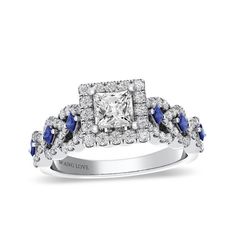 a diamond and blue sapphire engagement ring with diamonds on the sides, set in 18k white gold