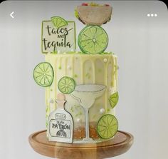 a cake decorated with limes and margarita