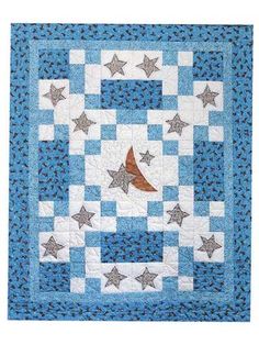 a blue and white quilt with stars in the center on it, along with a brown bird