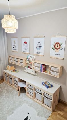 a child's room with toys and artwork on the wall