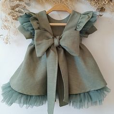 Sage green linen dress with tulle for baby girl boho style ruffles, we make it in any color you need. It is ideal for weddings, christenings, parties, flower girls, birthdays or for a special occasion and the perfect gift for toddlers and newborns. Do you want this model with a touch of color? click on this link: https://www.etsy.com/listing/1572587204/baby-flower-girl-dress-long-sleeve-red?click_key=52e62c4ff97d446620fb99362fd115fe357aa7e9%3A1572587204&click_sum=7dc46227&ref=shop_home_active_80 Newborn Baby Dress Design, Sage Green Flower Girl Dress, Green Flower Girl Dress, Green Flower Girl Dresses, 1st Birthday Dress, Newborn Dress, Green Linen Dress, Dress For Baby Girl