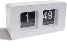 the clock is white and has two numbers on each side, which are numbered from 1 to 9