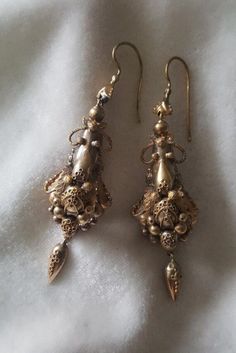 I love a good comfortable pair of long earrings! These are not marked but have been tested for gold of 14k. They are 2 1/2 inches long and are nice and light. They weigh in at 4.6 grams and in nice cindition. C. 1860 and American. Follow me on instagram@jettesjewels. Antique 14k Gold Hallmarked Earrings, Ornate Hallmarked Dangle Chandelier Earrings, Ornate Hallmarked Chandelier Dangle Earrings, Victorian Dangle Earrings For Formal Occasions, Victorian Dangle Earrings Hallmarked, Victorian Hallmarked Dangle Earrings, Antique Gold Dangle Plug Earrings, Victorian Style Hallmarked Dangle Earrings, Gold Antique Plug Earrings