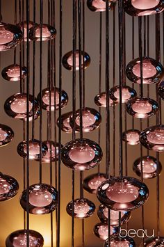 a bunch of glass balls hanging from the ceiling