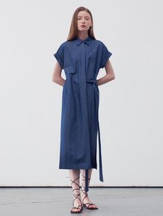 This product is a belted midi shirt dress that offers a versatile and contemporary take on the classic shirt dress. The piece features a pointed collar and a front button closure that runs the length of the dress, allowing for a customizable fit. The addition of a belt emphasizes the waist, while the midi length strikes an elegant balance between casual and formal. - The dress's side slits provide freedom of movement and a touch of allure.- Its roll-up sleeve design adds a casual, effortless look, suitable for different seasons.- The lightweight fabric ensures comfort and breathability throughout the day.- This midi shirt dress can be dressed up with heels or down with flats, making it a staple for any occasion. Short Sleeve Midi Dress With Placket For Workwear, Summer Office Shirt Dress With Collared Neckline, Belted Shirt Dress With Spread Collar For Office, Office Shirt Dress With Belt And Spread Collar, Spring Short Sleeve Belted Dress For Work, Spring Business Casual Dress With Placket, Spring Workwear Shirt Dress With Collared Neckline, Spring Collared Shirt Dress For Work, Collared Shirt Dress With Belted Cuffs For Work