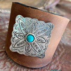 Treat your wrists to a wild western escape with this GONE WESTERN Leather Cuff Bracelet! Crafted from leather with a square concho and a turquoise gem, this little beauty adds plenty of style and sass to any look! Put a little cowboy twinkle into your wardrobe and stir up some fun! LENGTH: 8.5" Western Style Leather Bracelet With Concho As Gift, Western Style Leather Bracelet With Concho, Western Style Leather Concho Bracelet As Gift, Adjustable Western Leather Bracelet For Festivals, Western Style Adjustable Cuff Bracelet For Festivals, Adjustable Concho Cuff Bracelet For Festival, Western Style Concho Bracelets For Festivals, Western Concho Bracelets For Festival, Adjustable Western Style Cuff Bracelet For Festivals