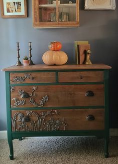 an old dresser with some decorations on top