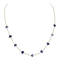 A chic way to add a pop of blue and "heart" to your neck stack. Nine blue lapis hearts with gold chain in between makes it a perfect necklace for layering or to wear on it's own. It's also great for gifting!  lapis; 16-18 inches  Exact dimensions are unknown. Please reach out in the seller Q&A for any questions on measurements. Blue Dainty Necklace With Heart Charm, Dainty Blue Necklace With Heart Charm, Elegant Blue Jewelry With Heart Beads, Blue 14k Gold Heart Pendant Jewelry, Blue 14k Gold Cable Chain Jewelry, Blue Dainty Chain Necklace With Delicate Chain, Blue Dainty Chain Necklace, Dainty Blue Chain Necklace With Delicate Chain, Blue 14k Gold Necklace With Adjustable Chain