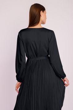 Our stunning Long Sleeve Pleated Satin Maxi Dress is an elegant and fashionable addition to your evening wear collection. Featuring long puffed sleeves, a crossover front with a dainty waist tie, and a long pleated satin skirt, this beautiful ensemble is the ideal choice for any party or formal event. Chic V-neck Dress With Belt, Elegant V-neck Belted Mini Dress, Satin Midi Dress With Tie Waist For Evening, Elegant Long Sleeve Pleated Belted Dress, Formal V-neck Mini Dress With Pleated Sleeves, Satin Midi Dress With Tie Waist, Satin Dresses With Tie Waist For Night Out, Satin Tie Waist Dress For Night Out, Satin Dress With Tie Waist For Night Out