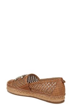 An espadrille-inspired flat features a breezy latticed design highlighted by a woven cap toe, gleaming logo hardware and earthy jute trim. 1" heel Textile upper/leather lining/synthetic sole Imported Casual Woven Leather Espadrilles, Casual Woven Leather Espadrilles With Round Toe, Casual Leather Espadrilles With Woven Detail, Spring Slip-on Woven Leather Flats, Woven Leather Round Toe Espadrilles, Woven Leather Espadrilles With Round Toe, Spring Woven Leather Flats With Round Toe, Espadrille Flats With Woven Sole, Closed Toe Woven Leather Espadrilles