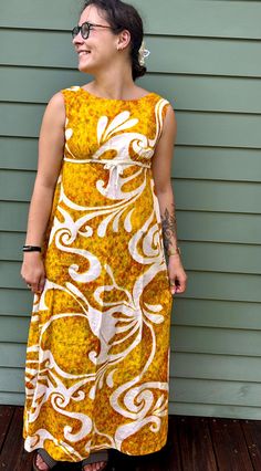 Vintage gorgeous 1960s-era maxi dress fro Malahini Designer's Collection, 100% cotton, made in Hawaii.  Princess styling, fit and flare, great 60s-era print.  A beautiful vintage maxi.   Freshly laundered and line-dried for you!  Approximate garment measurements laid flat (all measurements in INCHES): across shoulders: 15 across armpits: 17.5 waist: loose hips: loose front collar to bottom: 49  back collar to bottom: 46 across bottom: 52 Please note that our shipping prices include tracking, insurance, and assume "worst-case" - i.e., to the West Coast from our East Coast shop - we refund overestimations on shipping as per our Shipping Policies.  We ship to most countries - convo us for combined or non-US shipping rates. For more fab vintage clothes and shoes, check out the rest of our shop Retro A-line Maxi Dress, Retro Maxi Dress For Beach, Retro Yellow Maxi Dress, Retro Cotton Maxi Dress, Yellow Cotton Retro Vintage Dress, Yellow Retro Maxi Dress, Vintage Cotton Maxi Dress, 1970s Cotton Dress With Retro Print, 1970s Retro Print Cotton Dress