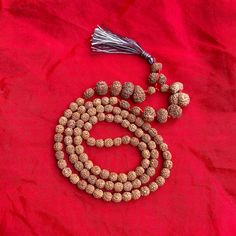 "Dimension:- Weight         : 43 Grams  Length          : 20.5\" Inches  Bead Size     : 7-20 MM (Small to big) No. of Beads : 107 Beads Shape            : Oval & Round Faces             : 1-14 Face, Ganesh, Gauri Shankar  Color              : Brown  Uses               : Meditation, Prayer  Certified by  : Rudraksha & Gems Testing Lab This is a divine Rudraksha Siddha Mala. Lab Certified 107 bead Rudraksha Siddha Mala Consist of 1 to 14 Mukhi, Gaurishankar, Ganesha Beads Rudraksha Mala.  Other items from our shop you may like it:- https://naturalcrystalshub.etsy.com/listing/1071204570 https://naturalcrystalshub.etsy.com/listing/1085151419 PACKAGING DETAILS:- We Wrap the product with multiple layers of bubble wrap and secure it with tape. We place the wrapped product in a suitable wooden or Spiritual Hand-strung Beaded Necklaces For Rituals, Spiritual Round Beads Jewelry For Puja, Traditional Jewelry For Meditation With 8mm Beads, Traditional Jewelry With 8mm Beads For Meditation, Spiritual Mala With 8mm Beads For Rituals, Traditional 8mm Beads Jewelry For Meditation, Traditional Necklaces With 8mm Beads For Rituals, Bohemian Mala For Rituals And Festivals, Spiritual Necklaces With 8mm Beads For Rituals