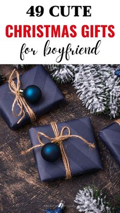 presents wrapped in blue paper and tied with twine on top of a wooden table