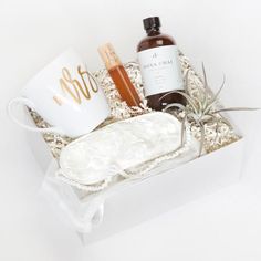 an open box containing personal care items and a cup with the word spa on it