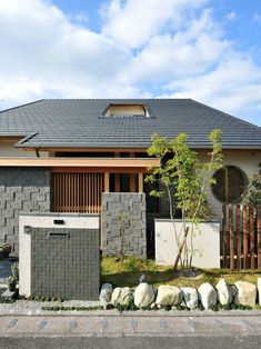 a house that is made out of grey bricks