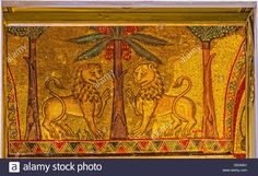 an ancient mosaic with lions and palm trees