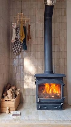 a wood burning stove in a tiled room