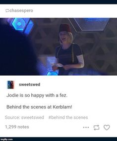 a woman standing in front of a screen with the caption jodie is so happy with a fez behind the scenes at kerbian source sweeted