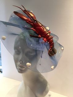 Sea food Festival- Lobster Festival - Lobster Hat- Beach Headpiece- Wedding - Shell headband- Beach headpiece- Mermaid costume Hello, This fascinator can be worn at a beach wedding, birthday, Derby ,or for a mermaid costume. It's made with a plastic Lobster and real shells. It is 2 inches high and diameter is 10 inches wide. One of a kind...each one is a little different. Netting (with tiny shells all over it) a is shown in blue like water but can be in other colors....just ask. It's lobster is Ocean Hat, Lobster Festival, Shell Headband, Unique Fascinators, Tiny Shells, Ocean Projects, Art Ocean, Mermaid Costume, Expressive Art