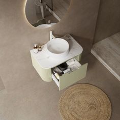 an aerial view of a bathroom sink and toilet in a room with beige carpeting