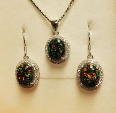 "Black Opal Necklace And Earring Set, Favorite 8x10mm Lab Created Opals With Multicolored Fire, See Video! 8x10mm 925 Sterling Silver Crystal Halo Settings, 18\" Sterling Chain, Ear Wires. Gift Box Included." Fire Opal Green Necklace, Black Opal Earrings, Black Opal Necklace, Black Opal Jewelry, Opal Jewelry Necklace, Opal Jewelry Set, Faberge Jewelry, Fire Opal Earrings, Pretty Accessories