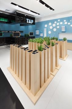 a group of wooden planters sitting on top of a white floor next to each other