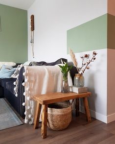 a living room filled with furniture and a wooden coffee table next to a blue couch